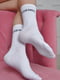 Шкарпетки білого кольору з написом | 6685716 | фото 2