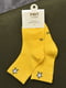 Шкарпетки жовтого кольору | 6685845