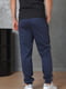 Спортивные штаны темно-синего цвета с полосками по бокам | 6686774 | фото 3