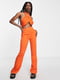 Штани помаранчевого кольору з кльошем штанин донизу | 6698849 | фото 2