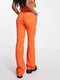 Штани помаранчевого кольору з кльошем штанин донизу | 6698849 | фото 3
