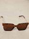 Сонцезахисні окуляри коричневого кольору в анімалістичній оправі | 6707386 | фото 3