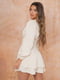 Коротка сукня ніжно-бежевого кольору з пишними рукавами та оборками | 6707389 | фото 4
