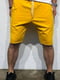 Жовті шорти з контрастним лампасом та кишенями | 6725711