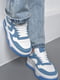 Кроссовки бело-синего цвета на шнуровке | 6725767 | фото 2
