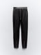 Эластичные облегающие брюки из экокожи черного цвета | 6729803 | фото 8