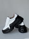 Шкіряні білі кросівки з чорними вставками на масивній підошві | 6730509 | фото 3