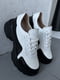 Шкіряні білі кросівки з чорними вставками на масивній підошві | 6730509 | фото 4