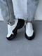 Шкіряні білі кросівки з чорними вставками на масивній підошві | 6730509 | фото 6