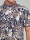 Хлопковая коричневая футболка-поло с принтом | 6727233 | фото 3