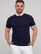 Бавовняна темно-синя футболка-поло з контрастним коміром та манжетами | 6727319