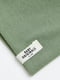 Шапка зелена в рубчик з невеликою текстильною аплікацією по краю | 6708692 | фото 2