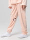 Піжама персикового кольору в принт: лонгслів та штани | 6740313 | фото 6