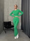 Зелений костюм: лонгслів та розкльошені штани | 6763965 | фото 4
