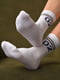 Шкарпетки спортивні білого кольору з принтом | 6769222 | фото 2