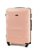 Середня світло-рожева дорожня пластикова валіза на 4-х колесах (62 л) | 6767400