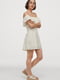 Сукня молочного відтінку з воланом зверху | 6774471 | фото 4