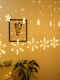 Новорічна світлодіодна гірлянда-шторка дощ "Сніжинки і Зірки" (138 LED 2.5 метра, теплий білий) | 6777279 | фото 2