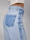 Блакитні джинси-кльош з лампасами та накладними кишенями | 6781042 | фото 4