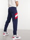 Сині спортивні штани з білими і червоними смужками збоку | 6791480 | фото 2