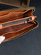 Кожаный кошелек-клатч шоколадного цвета на круговой молнии с ремешком | 6799019 | фото 2