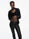 Эластичные облегающие брюки из экокожи черного цвета | 6729804 | фото 23