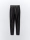 Эластичные облегающие брюки из экокожи черного цвета | 6729804 | фото 27