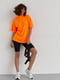Чорно-помаранчевий костюм: футболка, велосипедки та портупея | 6805703 | фото 4