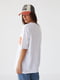 Біла трикотажна футболка з написом Houston Barley | 6806192 | фото 2