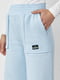 Трикотажні блакитні штани на флісі з накладними кишенями | 6806946 | фото 3