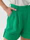 Короткі лляні шорти зеленого кольору з відворотом | 6807497 | фото 4