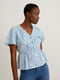 Клетчатая бело-голубая блуза с расклешенным низом с вышивкой | 6811747
