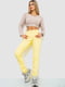Желтые зауженные брюки | 6810264 | фото 2