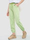 Салатовые брюки с манжетами на резинке | 6810574 | фото 3
