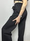 Трикотажні чорні штани-кльош з кишенями | 6766113 | фото 6