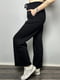 Трикотажні чорні штани-кльош з кишенями | 6766113 | фото 2