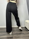 Трикотажні чорні штани-кльош з кишенями | 6766113 | фото 3