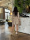 Бежева сукня А-силуету з квітковим принтом та розкльошеною спідницею | 6816551 | фото 9