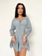 Міні-сукня А-силуету кольору хакі з принтом і оборкою | 6816615 | фото 2