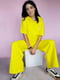 Трикотажний жовтий костюм-двійка: футболка і штани | 6827000 | фото 6