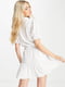 Біла сукня А-силуету з оборкою знизу | 6724038 | фото 2