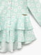 Блуза бірюзового кольору в квітковий принт, прикрашена подвійною куліскою | 6831759 | фото 2