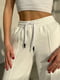 Розкльошені білі штани з акцентними швами | 6834787 | фото 4