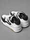 Кросівки біло-чорного кольору на шнурівці  | 6835731 | фото 3