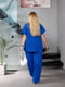Синій трикотажний костюм-двійка: блуза вільного крою, штани | 6858495 | фото 6