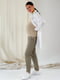 Бавовняні штани оливкові звуженого крою з бандажною резинкою під животик | 6865948 | фото 4