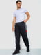 Трикотажные черные брюки с красно-серой вставкой | 6888970 | фото 2